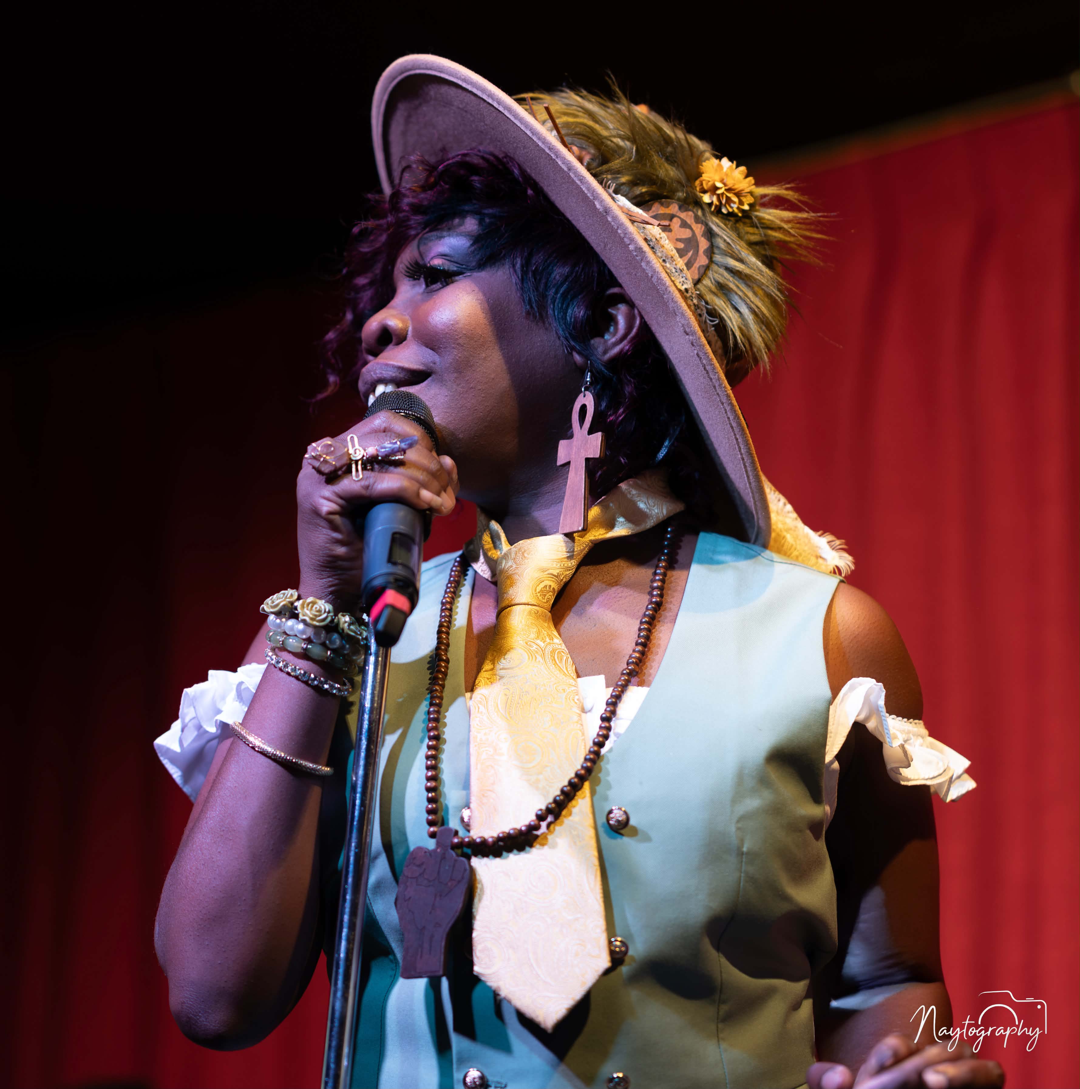 Sassy performing with microphone